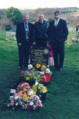 Roberts Graveside, his friends mourne